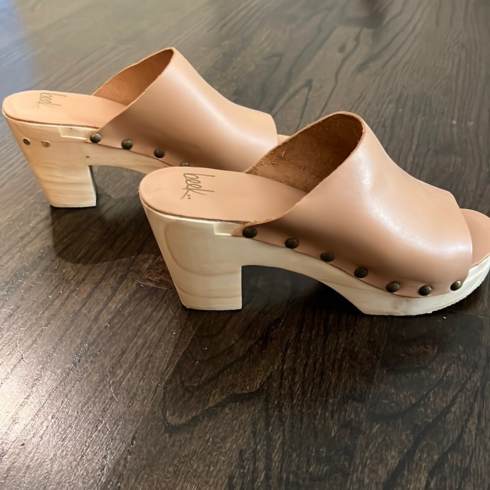 Pair of NEW Beek clogs. Wooden sole with a leather body.